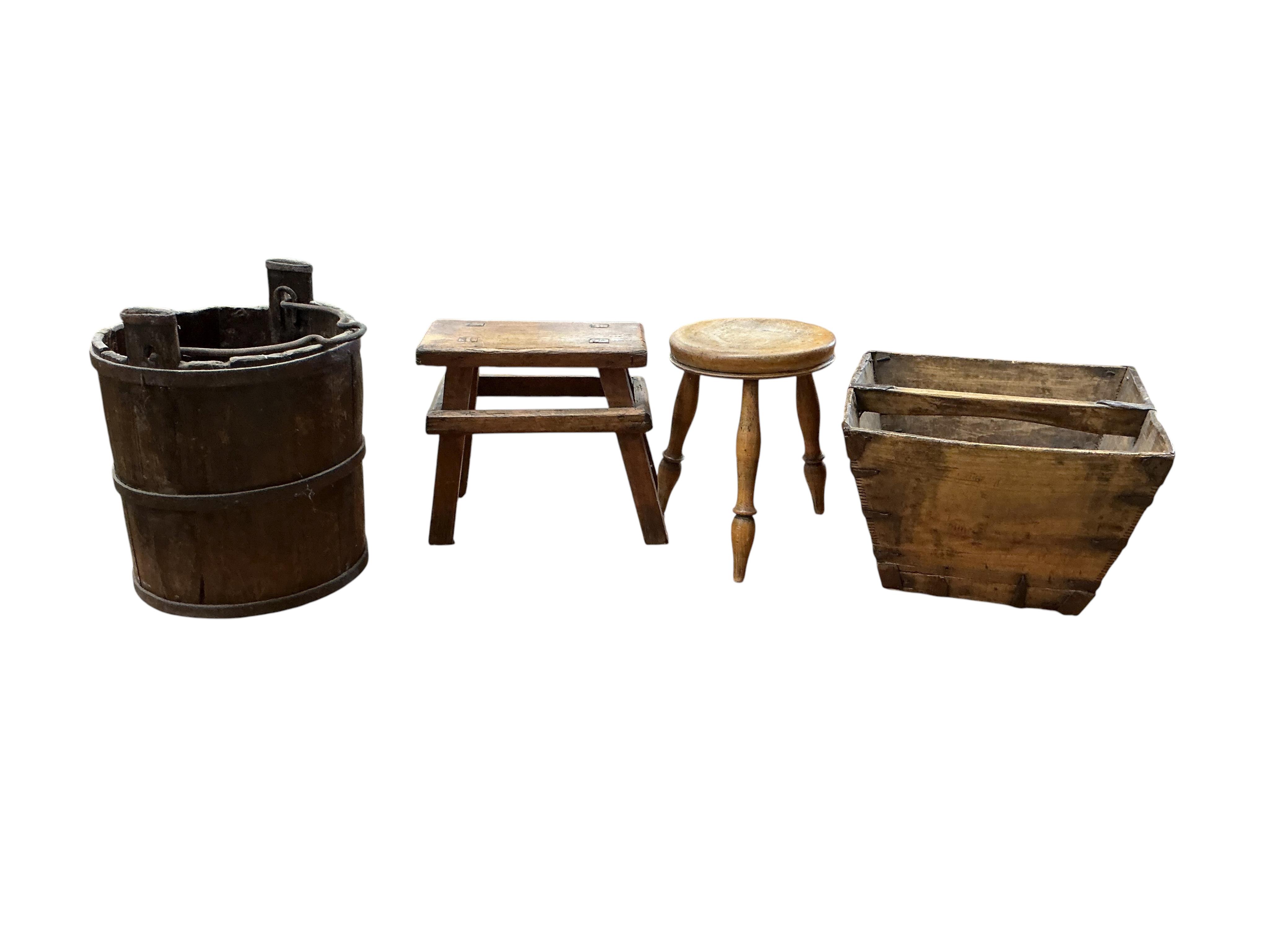 A small Victorian rectangular pine trunk, width 49cm, depth 29cm, height 22cm, together with two Provincial stools, a staved bucket and a measure